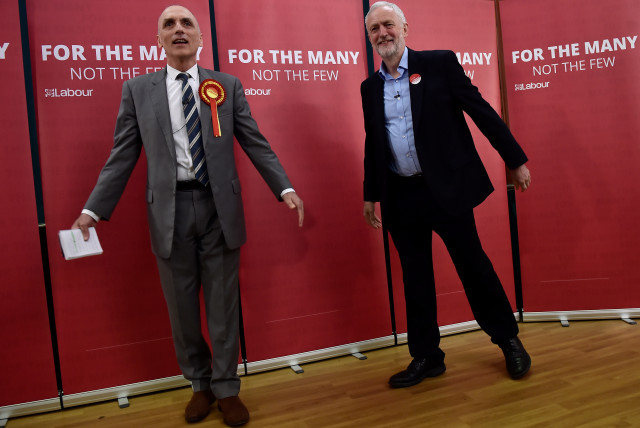 Britain's opposition Labour Party leader Jeremy Corbyn stands with local Labour candidate Chris Williamson (L) during an election campaign event in Derby, Britain May 6, 2017. (credit: Hannah McKay/Reuters)