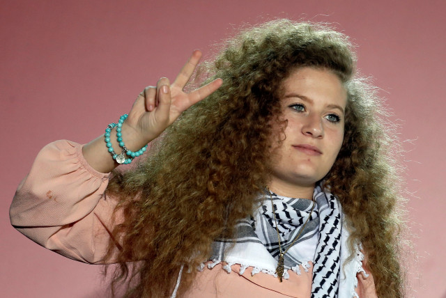  Palestinian teenager Ahed Tamimi, gives a peace sign following her speech at the annual festival of Greek Communist Youth in Athens, Greece, September 22, 2018. (credit: REUTERS/COSTAS BALTAS)