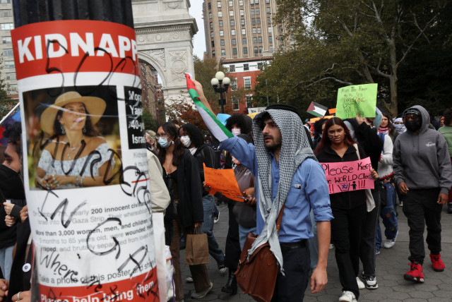  A poster with a picture of a woman and the word ''kidnapped,'' is seen as people attend a demonstration to express solidarity with Palestinians in Gaza as part of a student walkout by students of New York University, in New York City, US, October 25, 2023. (credit: Shannon Stapleton/Reuters)