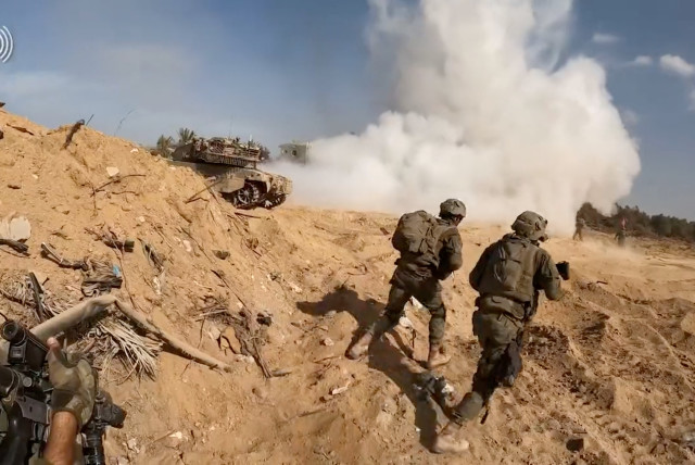  A screengrab taken from a handout video shows what the Israeli army says are its soldiers operating in a location given as the Gaza Strip, released on November 14, 2023.