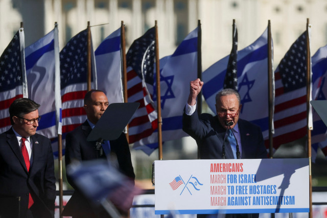  US Senate Majority Leader Chuck Schumer next to House Speaker Mike Johnson and House Democratic Leader Hakeem Jeffries, as supporters of Israel gather in solidarity and protest against antisemitism, amid the war with Hamas, during a rally on the National Mall in Washington, US November 14, 2023. (credit: Leah Mills/Reuters)