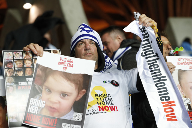  Euro 2024 Qualifier - Group I - Israel v Switzerland - Pancho Stadium, Felcsut, Hungary - November 15, 2023 Fans display pictures of hostages being held by Hamas in support of Israel amid the ongoing conflict between Israel and Hamas (credit: REUTERS/BERNADETT SZABO)