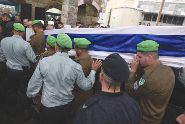  FAMILY AND FRIENDS of IDF solider Adi Malik mourn at his funeral in the Druze village of Beit Jann on Sunday, after he was killed during the ground operation in the Gaza strip (credit: David Cohen/Flash90)