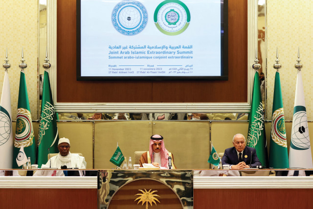  THE SECRETARIES-GENERAL of the Organization of the Islamic Cooperation (left) and the Arab League, with Saudi Arabia's foreign minister between them, hold a news conference at the joint Arab-Islamic summit in Riyadh, on November 11 (credit: AHMED YOSRI/ REUTERS)