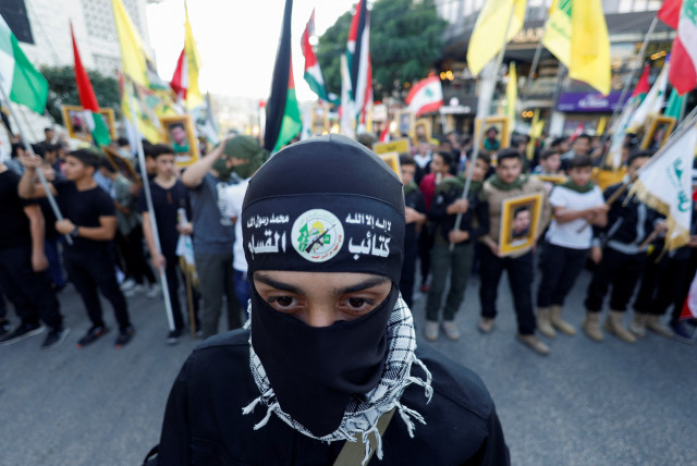  Lebanese Hezbollah supporters attend a protest in support of Palestinians in Gaza, amid the ongoing conflict between Israel and the Palestinian Islamist group Hamas, in Nabatieh, southern Lebanon November 18, 2023 (credit: REUTERS/ALAA AL-MARJANI)
