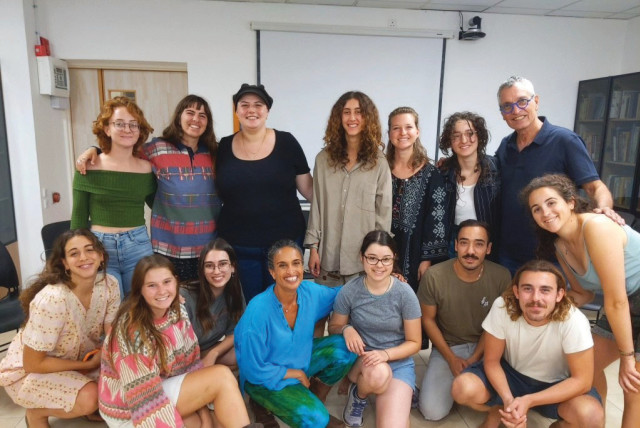  ACHINOAM NINI (NOA) (seated, 4th L)) and Gil Dor (standing, R) meet with Arava Institute students after their Kibbutz Ketura concert, Nov. 9. (credit: MICHAEL M. COHEN)