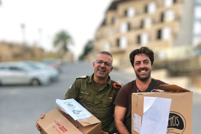  DR. AMIR KHNIFESS, chairman of the Israeli-Druze Center, and a soldier at a base in the North.  (credit: Amir Khnifess)