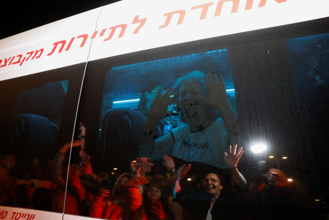  Aviva Adrienne Siegel, 62, who was released after being taken hostage during the October 7 attack by Palestinian militant group Hamas, reacts while being transported, in Ofakim, Israel, November 26, 2023 (credit: REUTERS/AMIR COHEN)