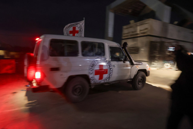  Red Cross vehicle carrying hostages abducted by Hamas during the October 7 attack on Israel, arrives at Rafah border, amid a hostages-prisoners swap deal between Hamas and Israel, in southern Gaza Strip, November 28, 2023. (credit: REUTERS/IBRAHEEM ABU MUSTAFA)