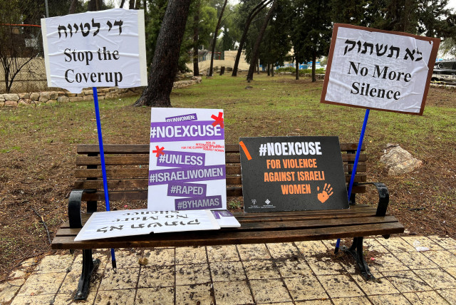  Signs against what protesters describe as international silence over sexual violence perpetrated against Israeli women during the attack by Palestinian Islamist group Hamas on southern Israel on October 7, are displayed on a bench at a protest in Jerusalem, November 27, 2023 (credit: REUTERS/DEDI HAYUN)