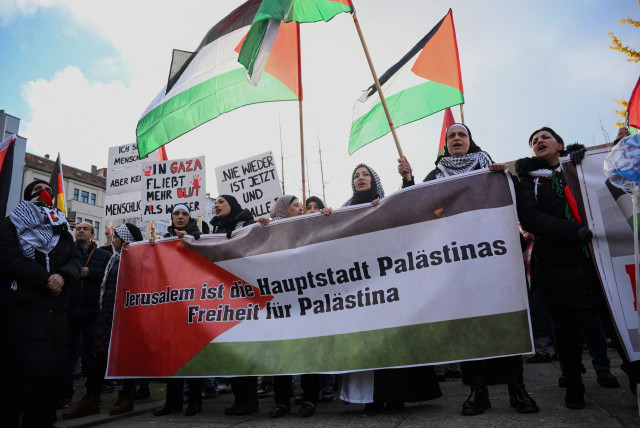  People hold a banner reading ''Jerusalem is the capital of Palestine Freedom for Palestine'' as they take part in a demonstration in solidarity with Palestinians in Gaza, amid the ongoing conflict between Israel and the Palestinian terrorist group Hamas, in Berlin, Germany November 18, 2023.  (credit: REUTERS/ANNEGRET HILSE)