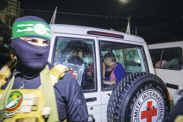  Israeli hostages are handed over to the International Red Cross at Rafah, this past week. (credit: FLASH90)