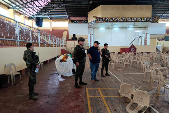  Lanao Del Sur Governor Mamintal Adiong Jr. looks on as law enforcement officers investigate the scene of an explosion that occurred during a Catholic Mass in a gymnasium at Mindanao State University in Marawi, Philippines, December 3, 2023. (credit: Lanao Del Sur Provincial Government/Handout via REUTERS)