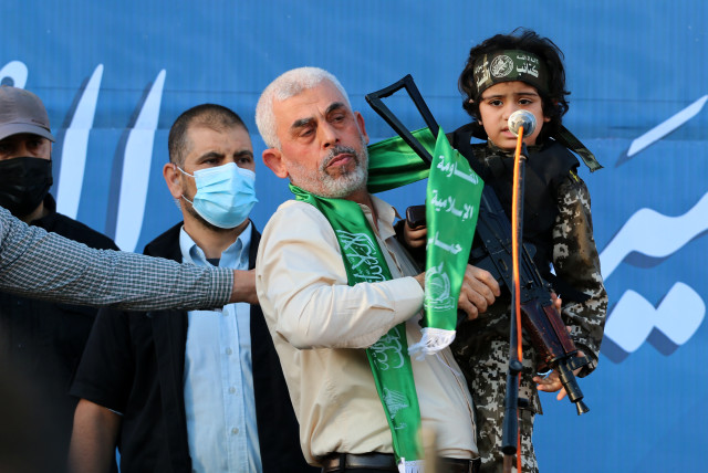  Yahya Sinwar, leader of the Palestinian Hamas terrorist movement, gestures on stage during a rally in Gaza City. May 24, 2021.  (credit: ATIA MOHAMMED/FLASH90)