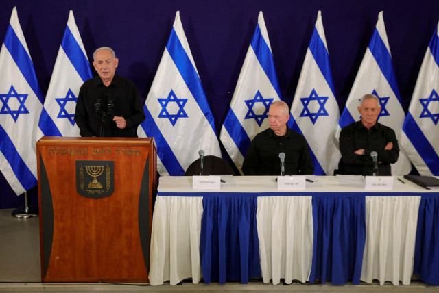  Israeli Prime Minister Benjamin Netanyahu, with Defense Minister Yoav Gallant and Cabinet minister Benny Gantz, speaks during a press conference in the Kirya military base in Tel Aviv, Israel, 28 October 2023 (credit: ABIR SULTAN/POOL/VIA REUTERS)