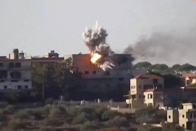  Smoke and fire rise from a building following an Israeli airstrike on Hezbollah targets in Lebanon, amid the ongoing cross-border hostilities between Hezbollah and the IDF, in this screengrab taken from an undated handout video released on November 24, 2023. (credit: IDF/Handout via REUTERS)