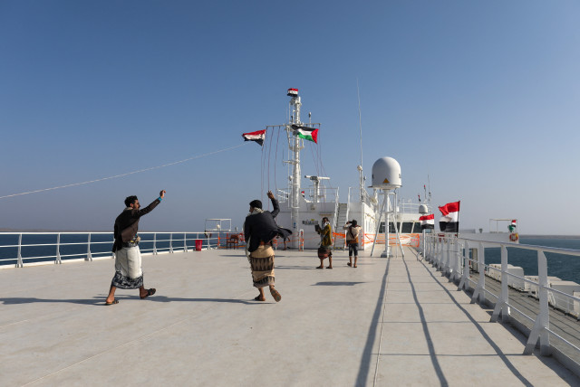  People dance on the deck of the Galaxy Leader commercial ship, seized by Yemen's Houthis last month, off the coast of al-Salif, Yemen December 5, 2023 (credit: REUTERS/KHALED ABDULLAH)