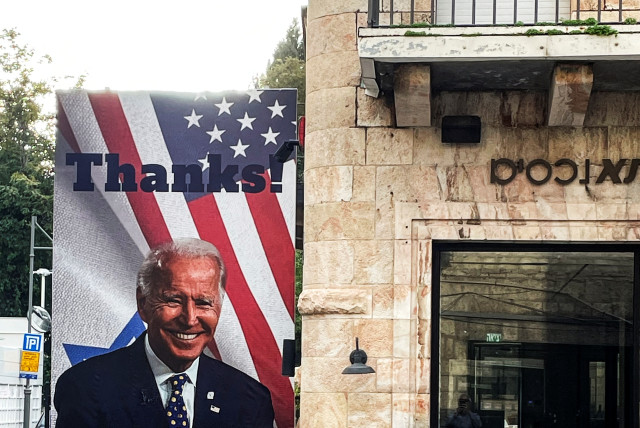  A depiction of US President Joe Biden smiling on a billboard with the word ''Thanks!'' emblazoned across it, is seen amid the ongoing conflict between Israel and Hamas, Jerusalem, November 28, 2023 (credit: REUTERS/Howard Goller)