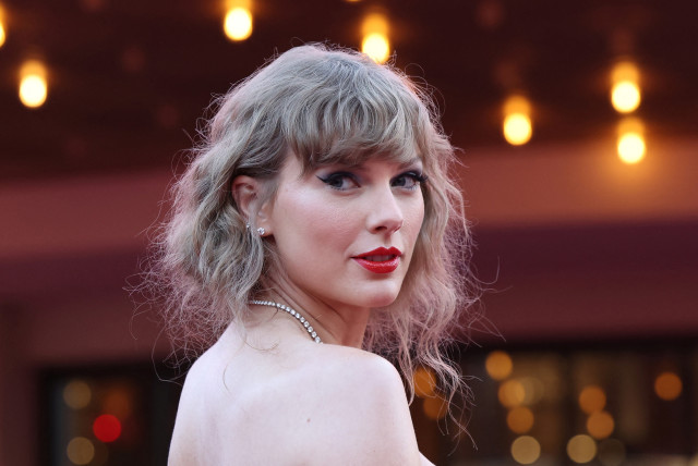  Taylor Swift attends a premiere for Taylor Swift: The Eras Tour in Los Angeles, California, U.S., October 11, 2023.  (credit: REUTERS/MARIO ANZUONI)