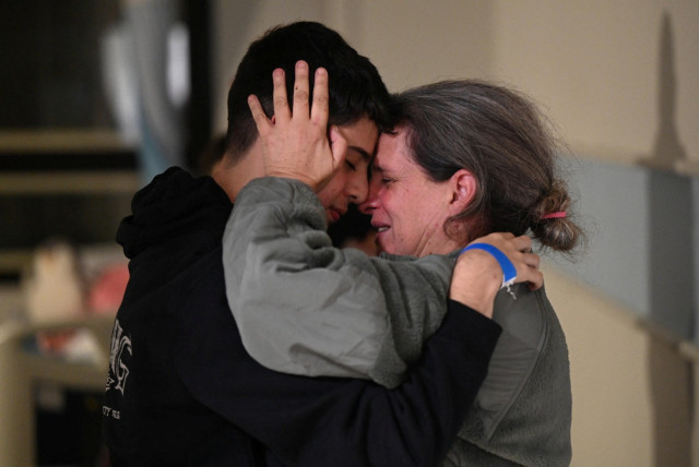  Sharon Avigdori, who was abducted by Hamas terrorists during the October 7 attack on Israel, hugs her son Omer shortly after being released on November 25.  (credit: HAIM ZACH/GPO)