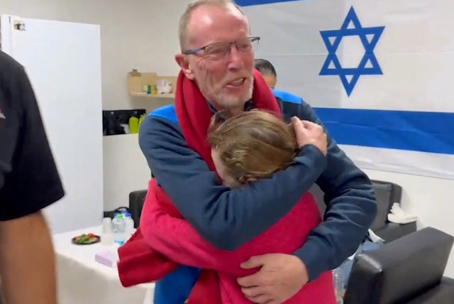  Emily Hand meets her father, Thomas Hand, after being released on November 25. (credit: IDF/Reuters)