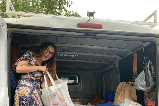  EMILY ZWIEBEL packs a truck with supplies for lone soldiers.  (credit: Courtesy Emily Zwiebel)