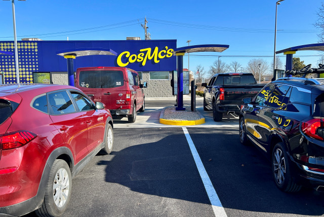  Lines form outside McDonald’s new beverage-led, drive-thru only chain, CosMc’s, during the concept’s secret opening in Bolingbrook, US. December 7, 2023. (credit: REUTERS/ERIC COX)