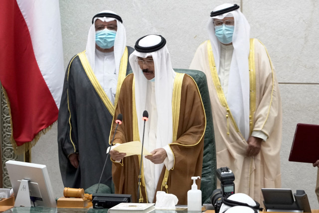  Kuwait's new emir Nawaf al-Ahmad al-Sabah holds a paper as he takes the oath of office at the parliament, in Kuwait City, Kuwait September 30, 2020. (credit: REUTERS/STEPHANIE MCGEHEE)