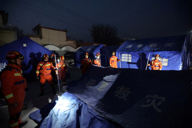  Rescue workers set up emergency tents at Kangdiao village following the earthquake in Jishishan county, Gansu province, China December 19, 2023. (credit: CHINA DAILY VIA REUTERS)