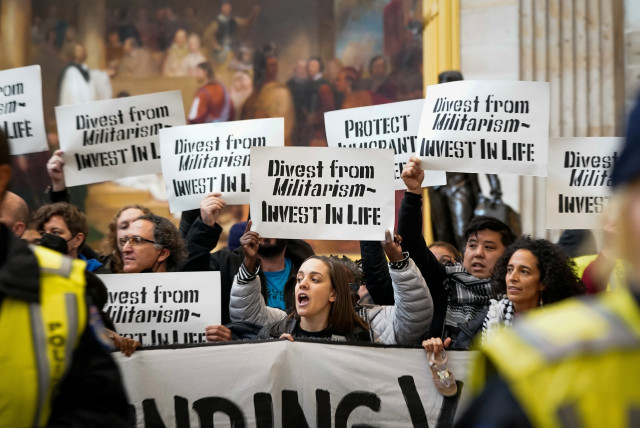 Protesters call for a ceasefire and an end to US military funding in the ongoing conflict between Israel and the Palestinian Islamist group Hamas, as they demonstrate inside the Rotunda of the US Capitol in Washington DC, December 19, 2023. (credit: REUTERS/ELIZABETH FRANTZ)