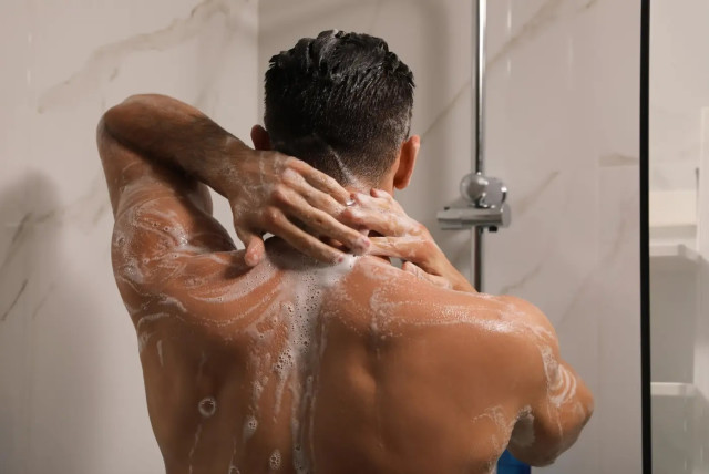 A man in the shower (Credit: Shutterstock / New Africa)