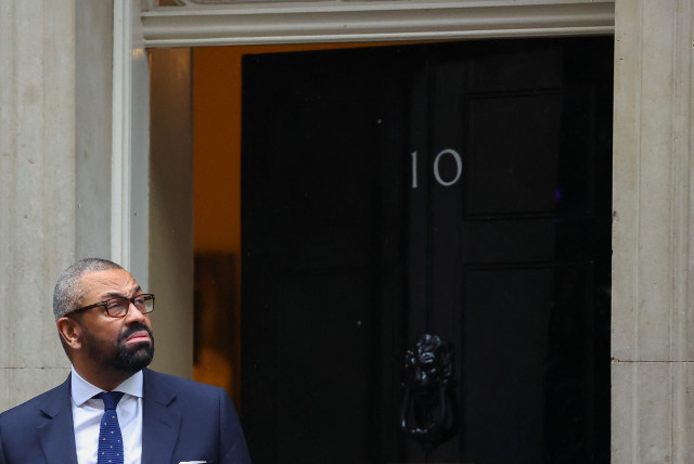  British Home Secretary James Cleverly reacts outside 10 Downing Street in London, Britain, December 19, 2023.  (credit: REUTERS/TOBY MELVILLE)