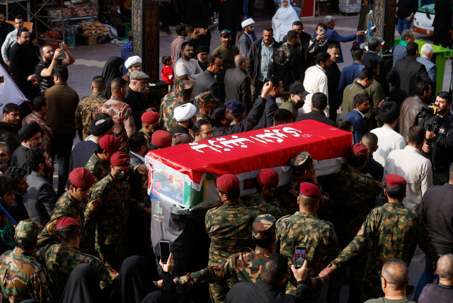  People carry the coffin of senior adviser for Iran's Revolutionary Guards, Sayyed Razi Mousavi, who was killed in an Israeli air strike outside the Syrian capital Damascus, during his funeral in Najaf, Iraq, December 27, 2023 (credit: REUTERS/ALAA AL-MARJANI)