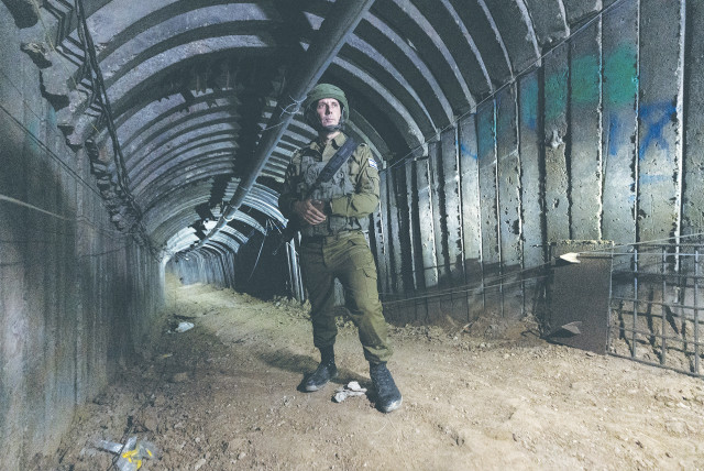  IDF SPOKESMAN Rear Admiral Daniel Hagari stands in a Hamas terror tunnel in the northern Gaza Strip, earlier this month. There must be a process that results in no terror tunnels, no terror leaders, no anti-Israel brainwashing in schools, no terror training, and no weapons, the writer asserts. (credit: AMIR COHEN/REUTERS)