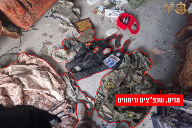 Weapons and uniforms located by the IDF's 5th Brigade, southern Gaza, December 29, 2023 (credit: IDF SPOKESPERSON'S UNIT)
