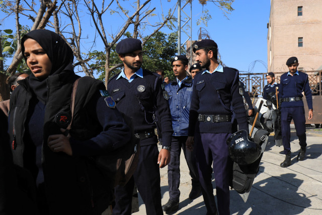  Police officers walk at the entrance of the district Judicial Complex in Islamabad, Pakistan November 28, 2023.  (credit: REUTERS/FAYAZ AZIZ)