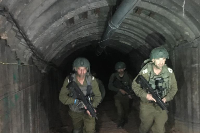 IDF soldiers operating in the tunnel used by Yahya Sinwar's brother in the Gaza Strip (credit: BENJAMIN WEINTHAL)