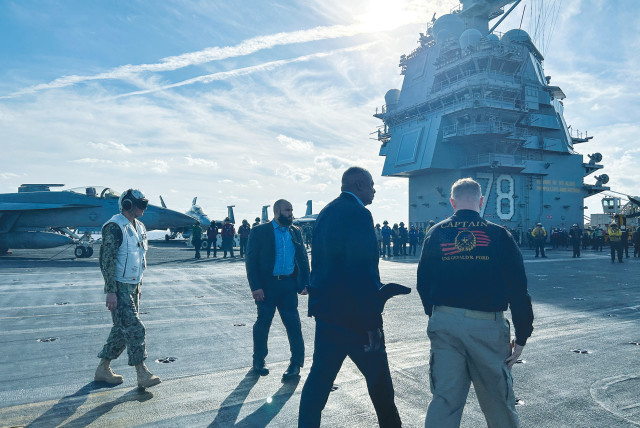  US DEFENSE SECRETARY Lloyd Austin (second from right) visits the aircraft carrier ‘USS Gerald R. Ford,’ in the Eastern Mediterranean, last month.  (credit: REUTERS/PHIL STEWART)