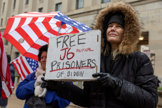  Activists from the group Look Ahead America (LAA) attend a protest in support of people charged with crimes related to the January 6, 2021 attack on the US Capitol, outside the Department of Justice in Washington, US, January 6, 2024. (credit: REUTERS/AMANDA ANDRADE-RHOADES)