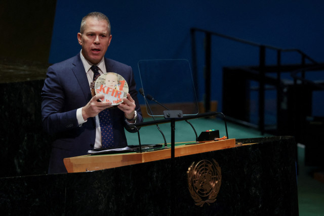  Israeli ambassador to the U.N. Gilad Erdan holds the picture of a child, who he says was kidnapped in the October 7 attack by Hamas, on a birthday cake during a plenary meeting on the 'Use of the veto - Item 63: Special report of the Security Council', in the General Assembly Hall at UN headquarter (credit: REUTERS/SHANNON STAPLETON)