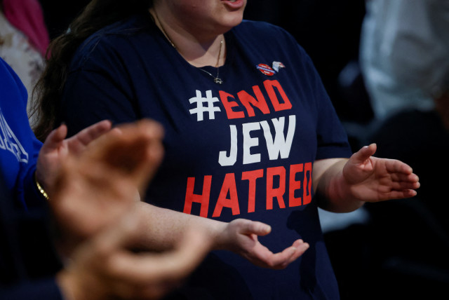  An attendee applauds during a pro-Israel rally at the Soloway Jewish Community Centre in Ottawa, Ontario, Canada October 9, 2023. (credit: REUTERS/BLAIR GABLE)