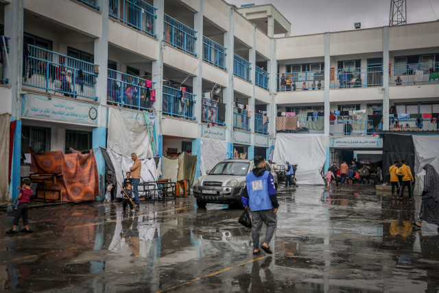  Palestinian at an UNRWA camp in Rafah after heavy rainfall, in the southern Gaza Strip, on November 14, 2023. (credit: ABED RAHIM KHATIB/FLASH90)