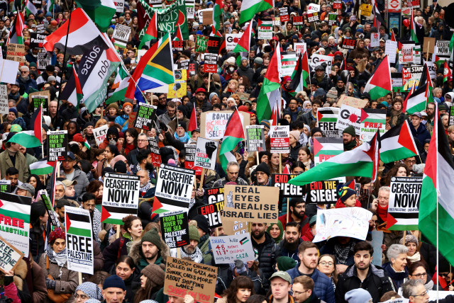  People take part in a protest to mark 100 days since the start of the ongoing conflict between Israel and the Palestinian Islamist group Hamas in Gaza during a march in London, Britain, January 13, 2024. (credit: REUTERS/KEVIN COOMBS)
