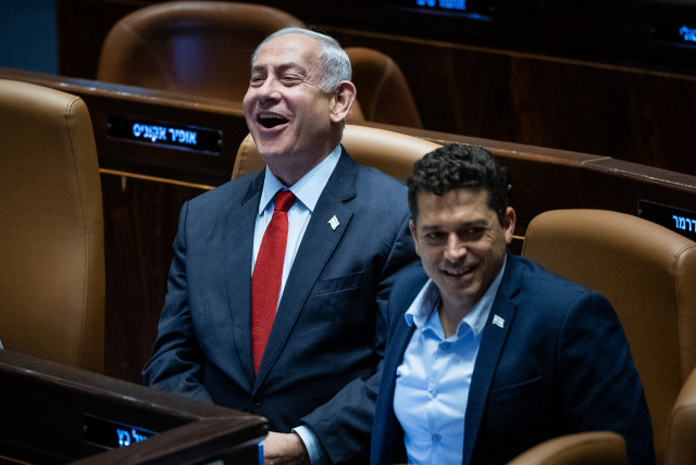 Prime Minister Benjamin Netanyahu with Diaspora Minister Amichai Chikl at the plenum hall of the Knesset, on June 26, 2023 (credit: YONATAN SINDEL/FLASH90)