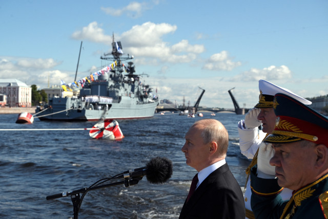  Russian President Vladimir Putin sails a patrol boat to congratulate the crews of warships and submarines on Navy Day, Saint Petersburg, Russia, July 30, 2023 (credit: Sputnik/Alexander Kazakov/Kremlin via REUTERS)