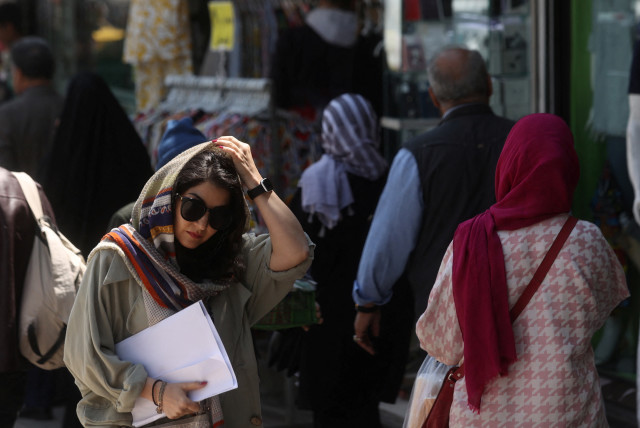  An Iranian woman walks on a street amid the implementation of the new hijab surveillance in Tehran, Iran, April 15, 2023 (credit: MAJID ASGARIPOUR/WANA/REUTERS)