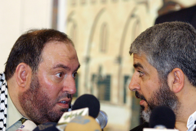  Mohammad Nazzal and Khaled Meshaal at a news conference in Damascus in this January 28, 2006. (credit: REUTERS/Khaled Al-Hariri/Files)