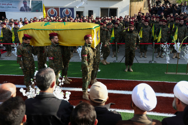  Members of Hezbollah carry a coffin during the funeral of Wissam Tawil, a commander of Hezbollah's elite Radwan forces who according to Lebanese security sources was killed during an Israeli strike on south Lebanon, in Khirbet Silem, Lebanon, January 9, 2024. (credit: REUTERS/Aziz Taher REFILE)