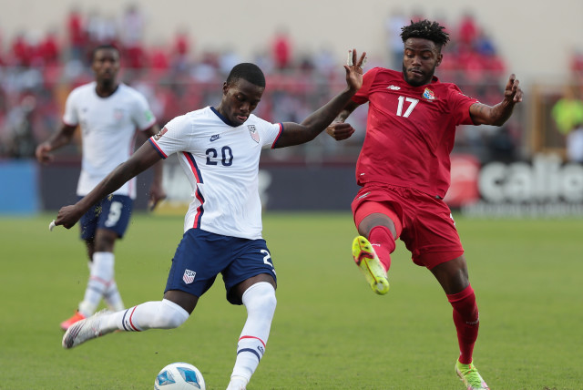  Soccer Football - World Cup - CONCACAF Qualifiers - Panama v United States - Estadio Rommel Fernandez, Panama City, Panama - October 10, 2021 Timothy Weah of the US in action with Panama's Freddy Gondola  (credit: ERICK MARCISCANO/REUTERS)