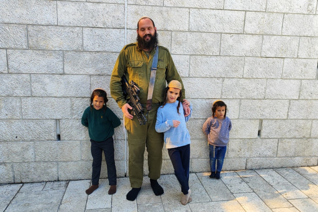  Rabbi Avraham Yitzchak Peirman and his three sons. (credit: Beyadenu)